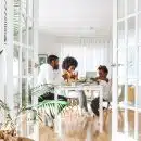 people sitting on chairs in front of table