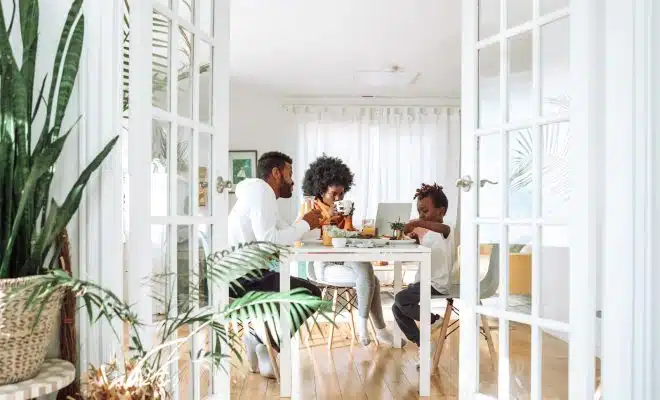 people sitting on chairs in front of table